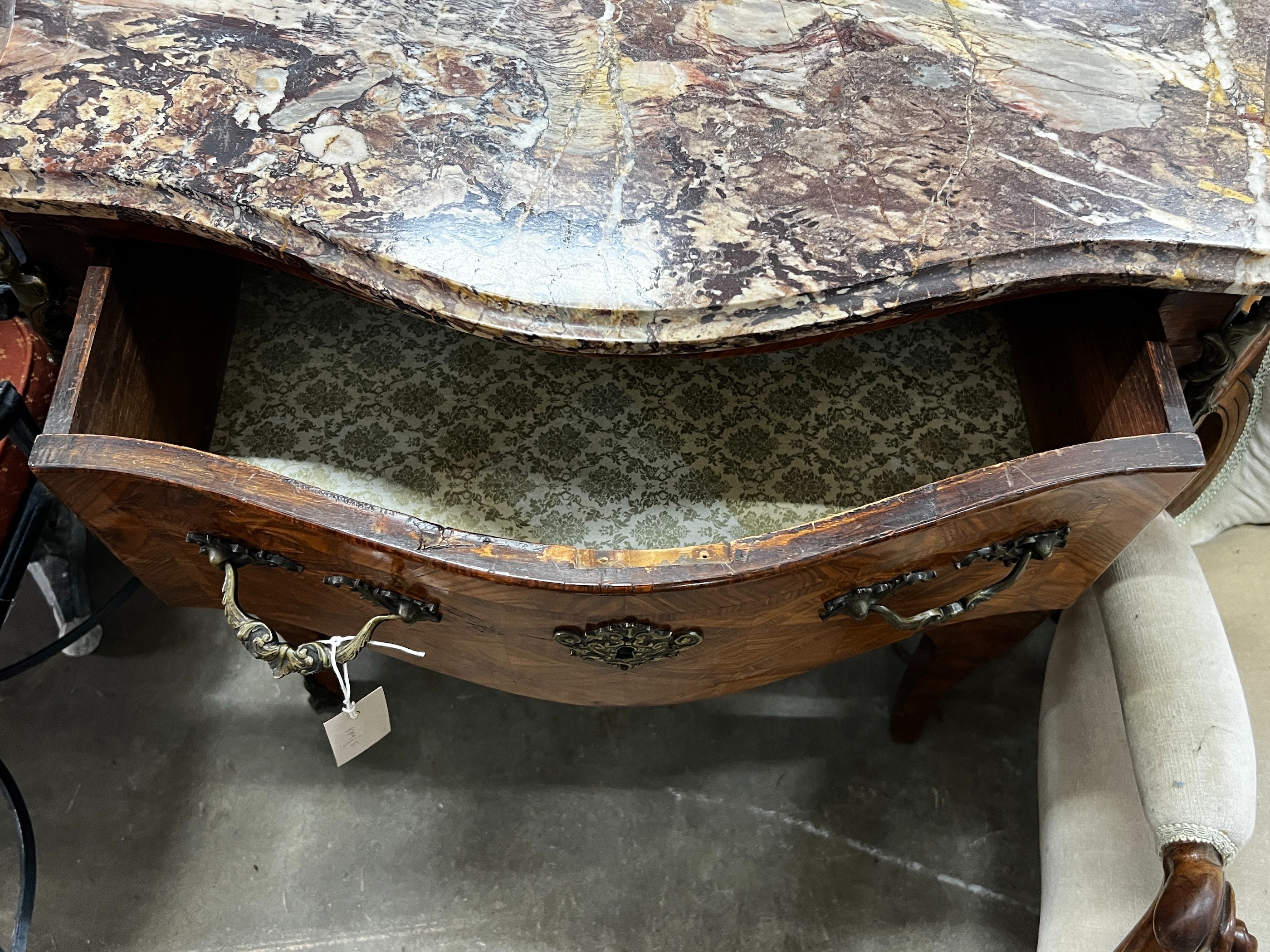 A small 19th century French transitional style gilt metal mounted kingwood marble topped two drawer serpentine commode, width 78cm, depth 39cm, height 75cm